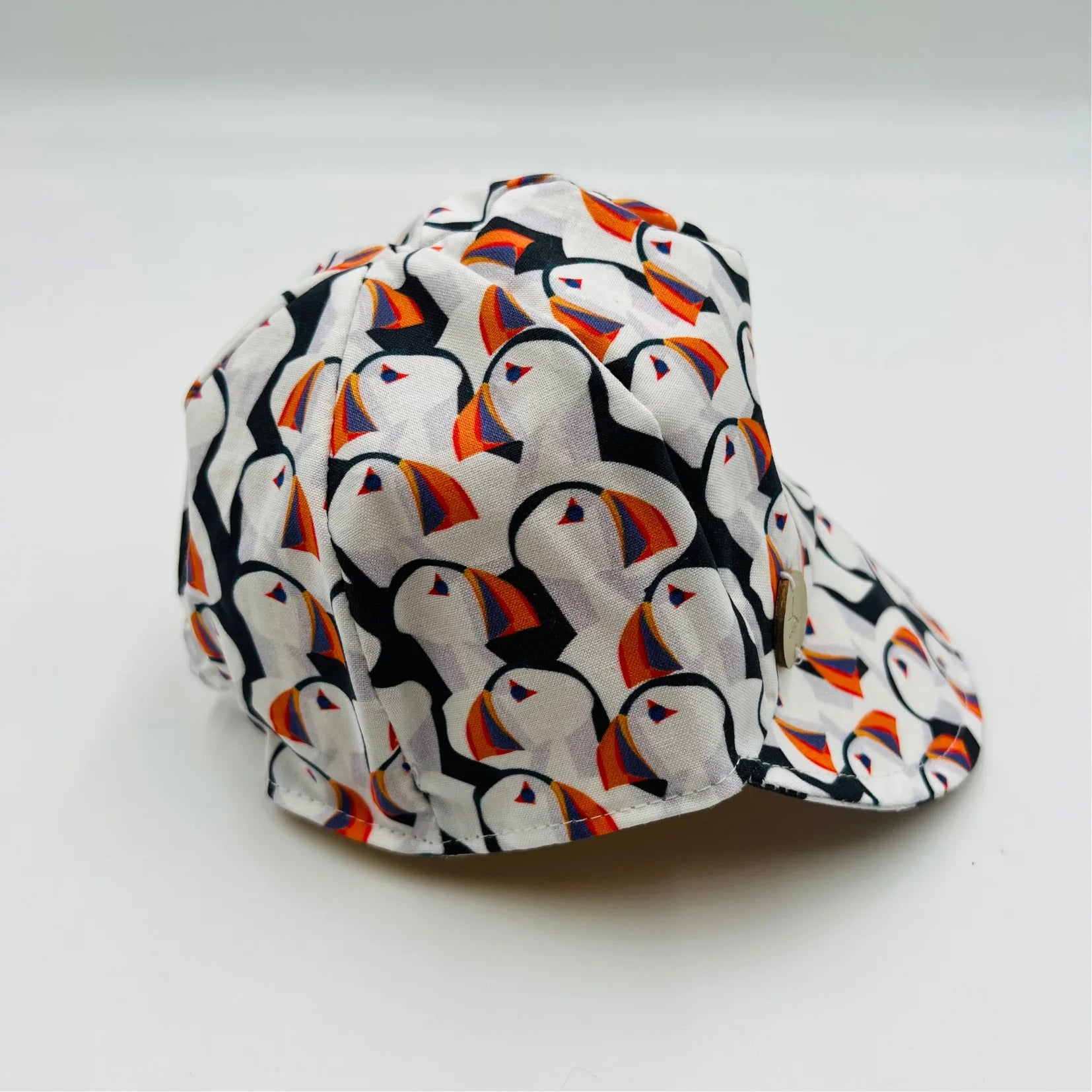 Puffin Baseball Cap with Newfoundland's puffin pattern on white base.