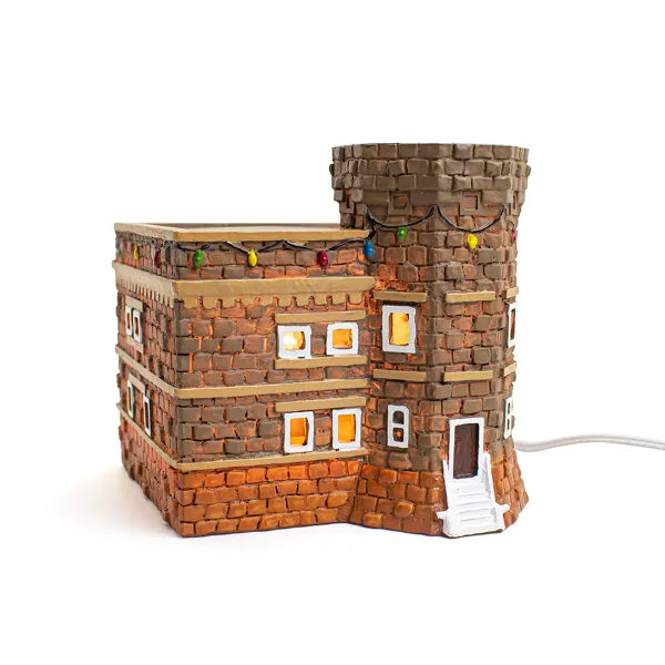 Brick-building-shaped-with decorative-lights-on- a-white-background