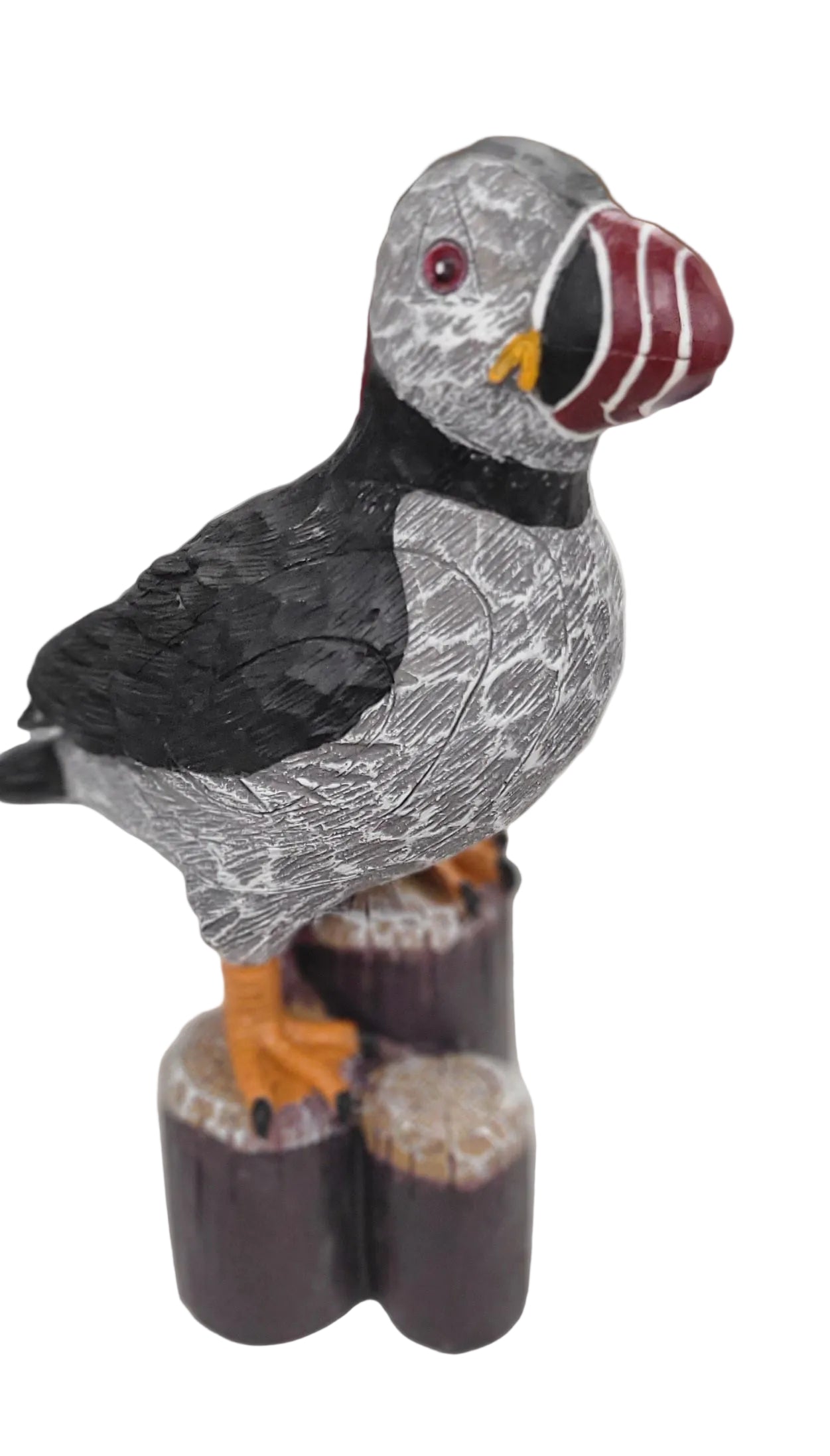 Decorative puffin figure on a white surface