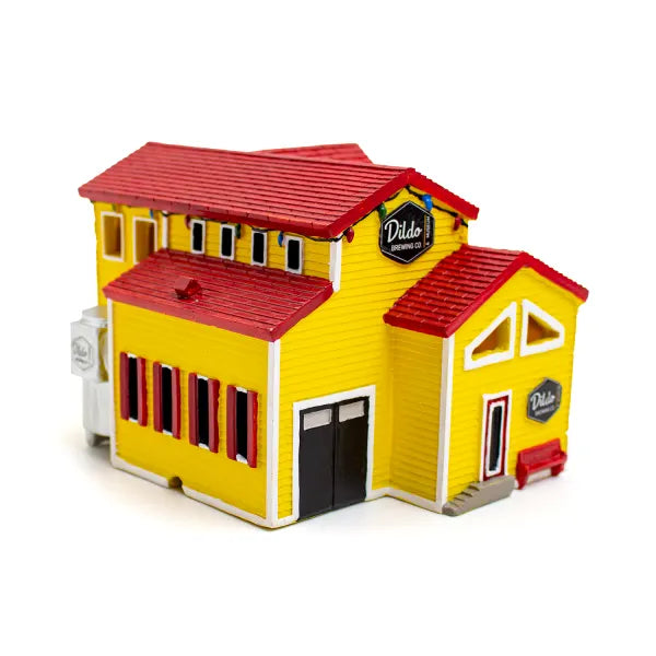 Dildo-brewery-building-with-yellow-walls-and- red-roof-on-a-white-background