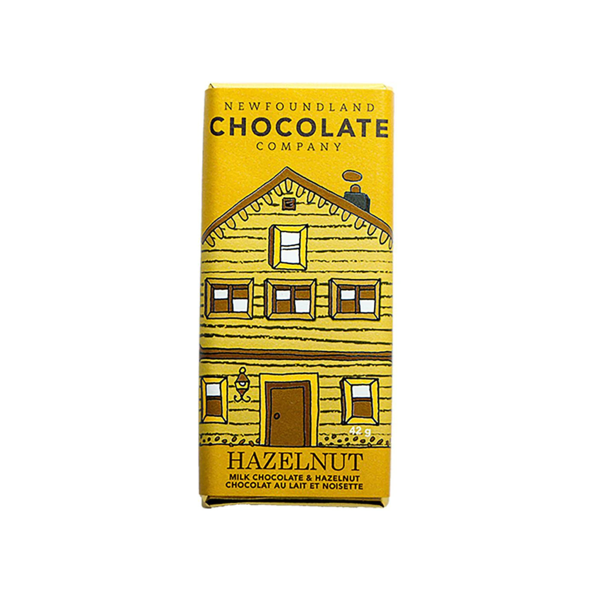 Yellow and brown packaging of hazelnut chocolate bar with a Newfoundland row house illustration.