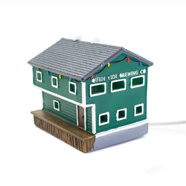 Miniature Quidi Vidi Brewery building with festive lights, Newfoundland Christmas village décor.