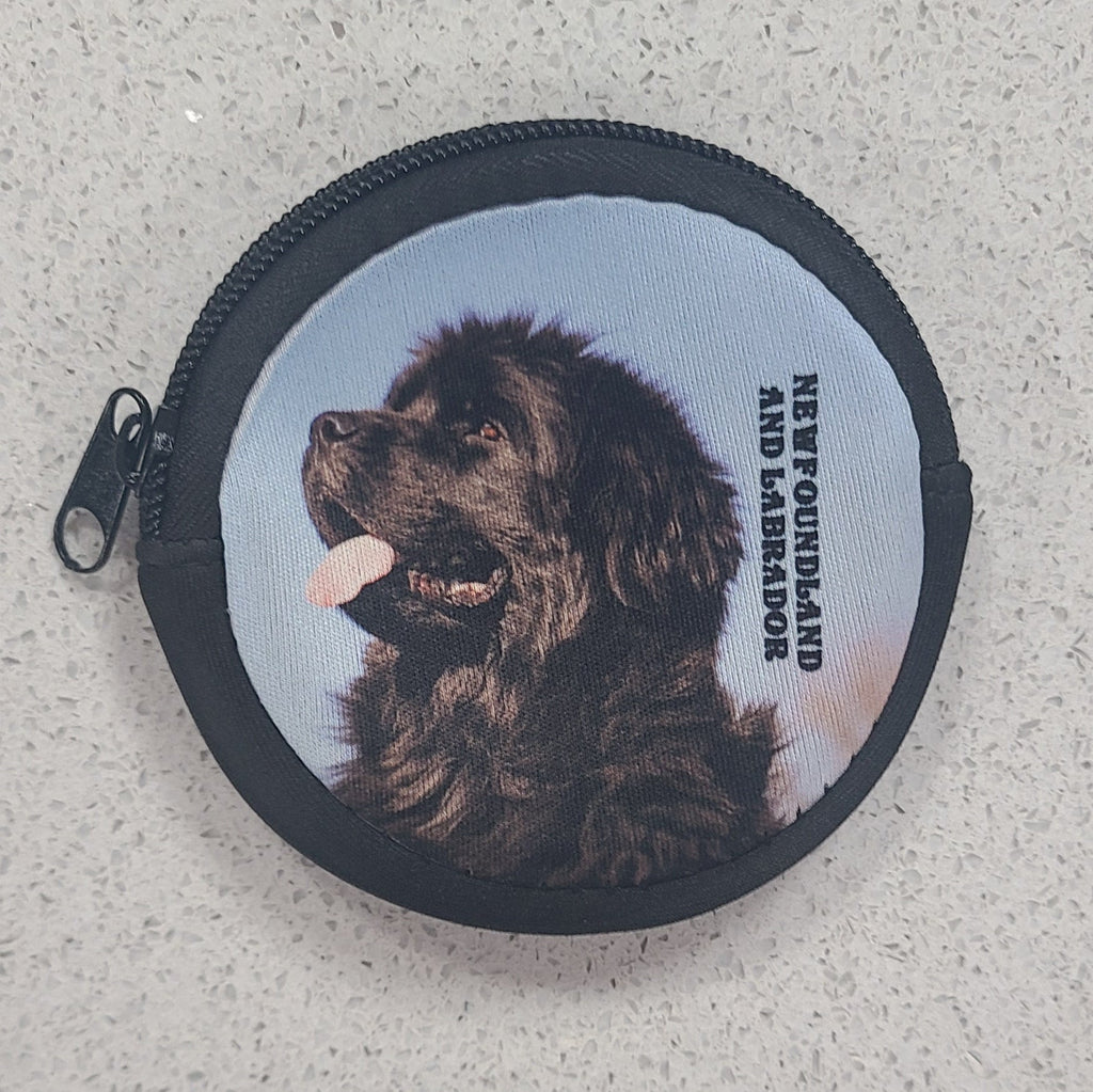 Round purse with a Newfoundland dog illustration and text on a textured surface