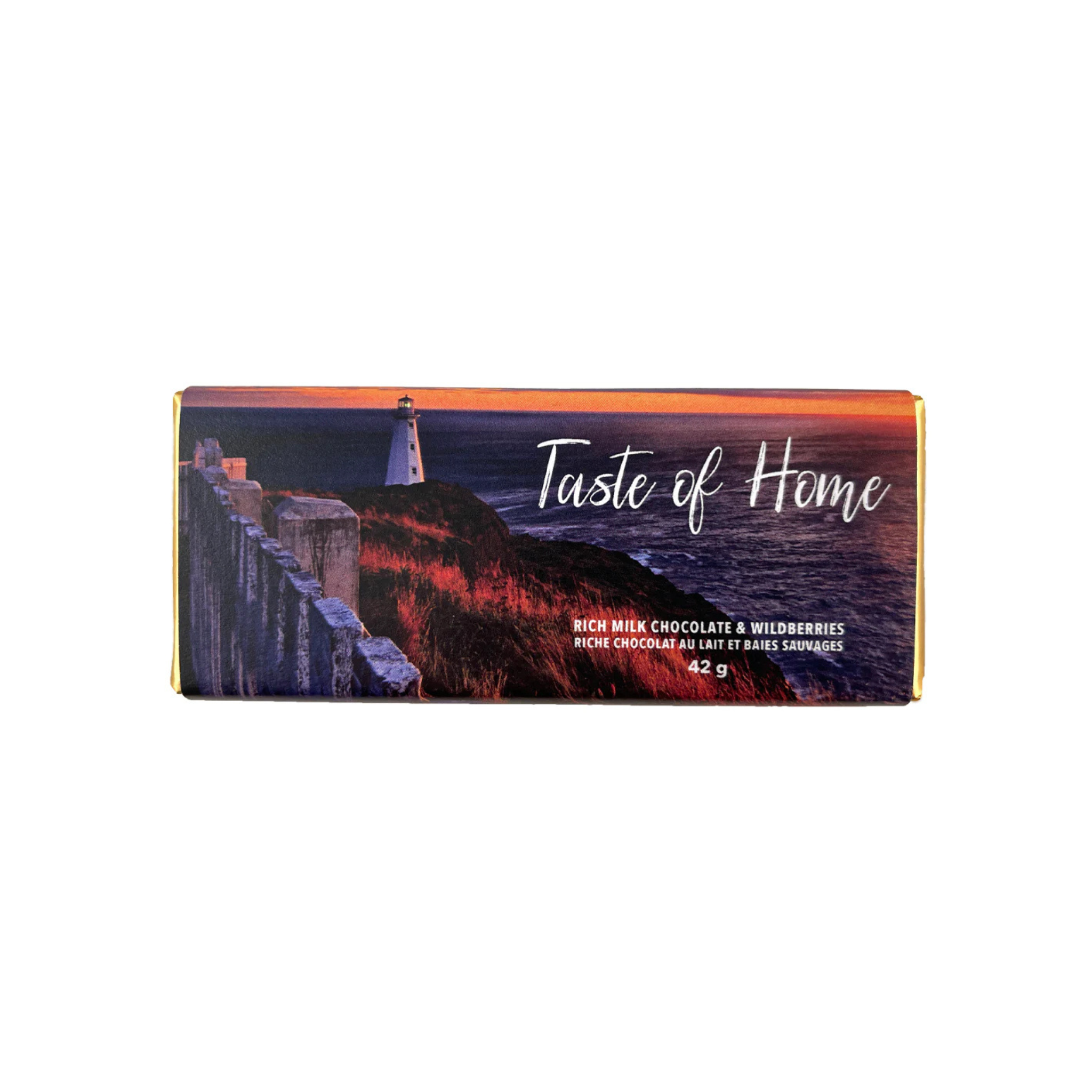 Taste of Home Chocolate Bar packaged featuring a scenic coastal Newfoundland image with a lighthouse on a rocky cliff at sunset, overlooking the ocean.