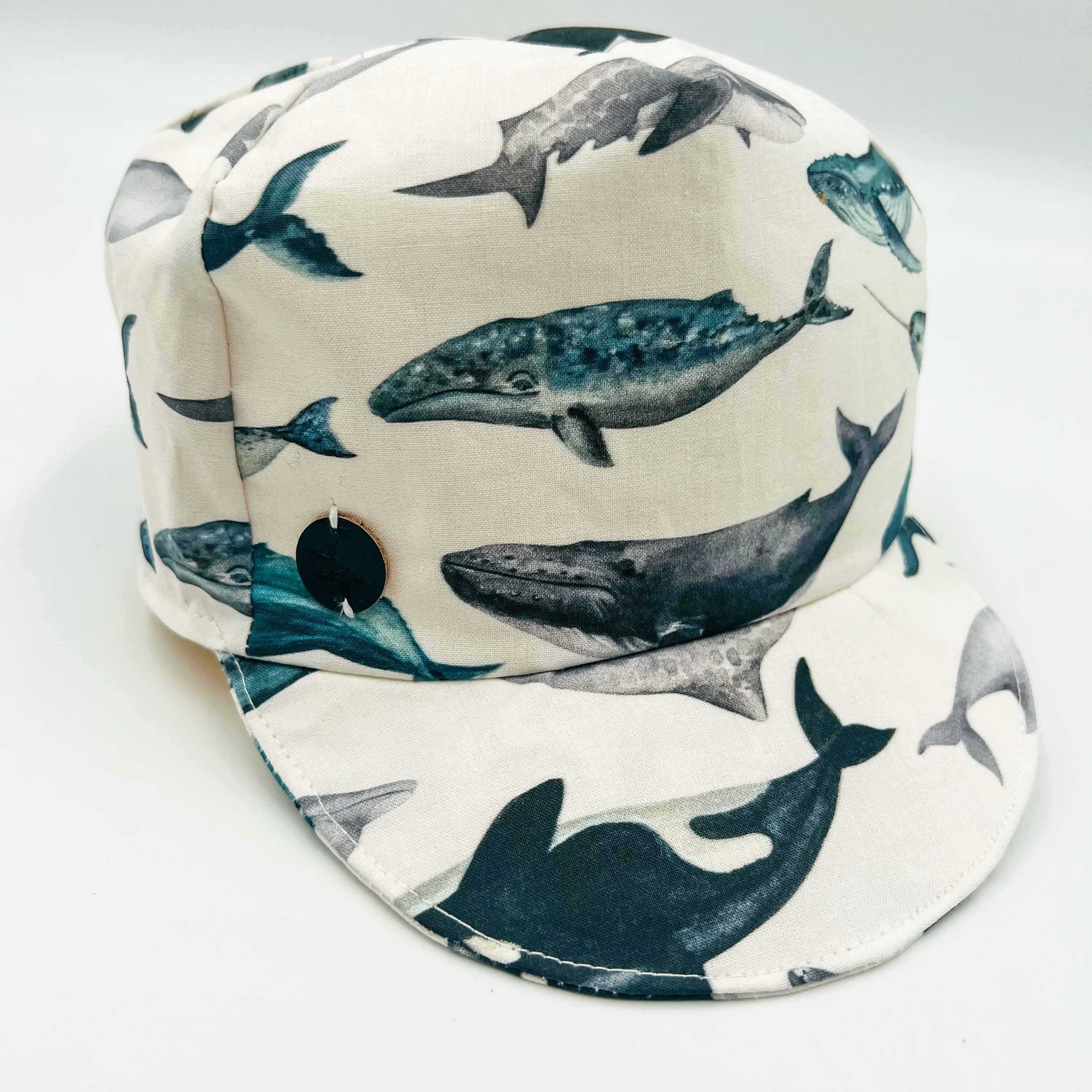 Baby Whale Baseball Cap featuring famous Newfoundland whales, side view.