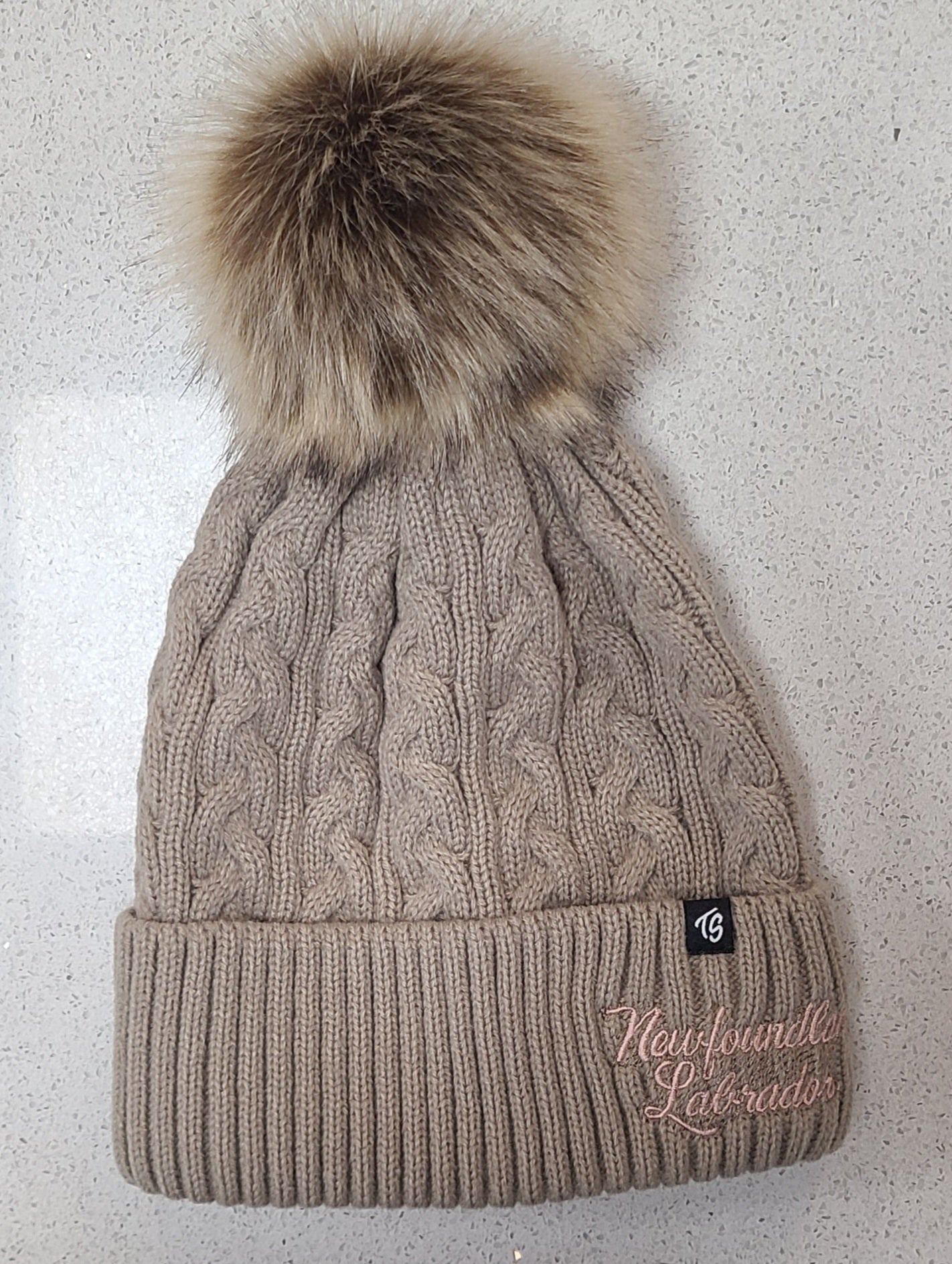 Winter hat with pom poms.