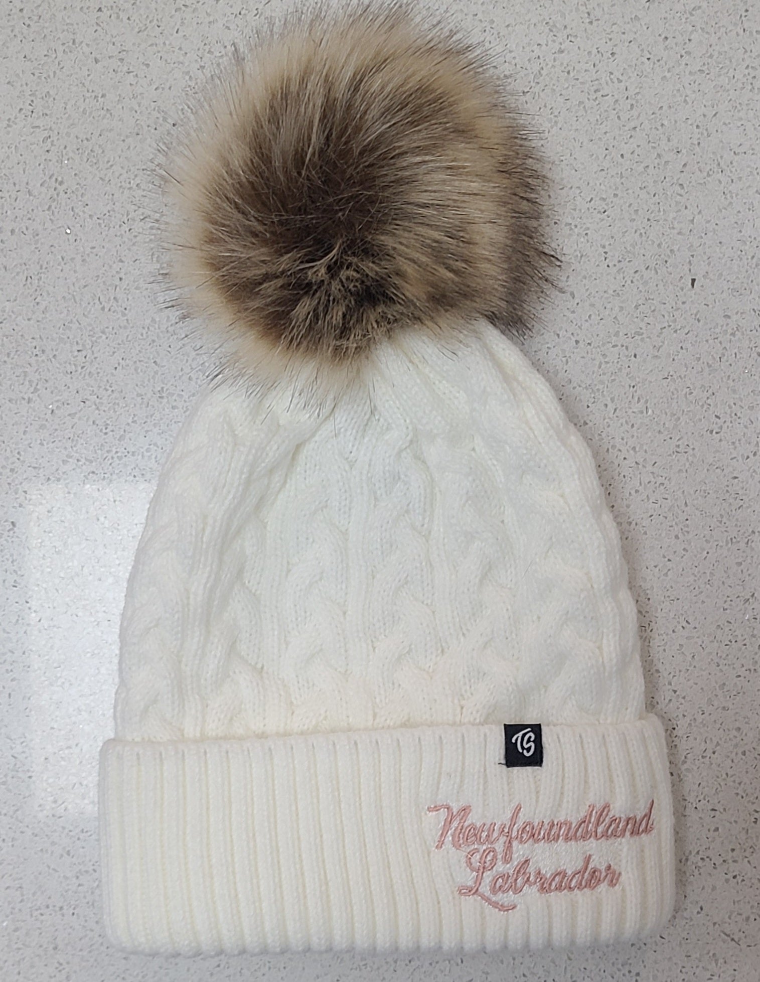 Winter hat with pom poms.