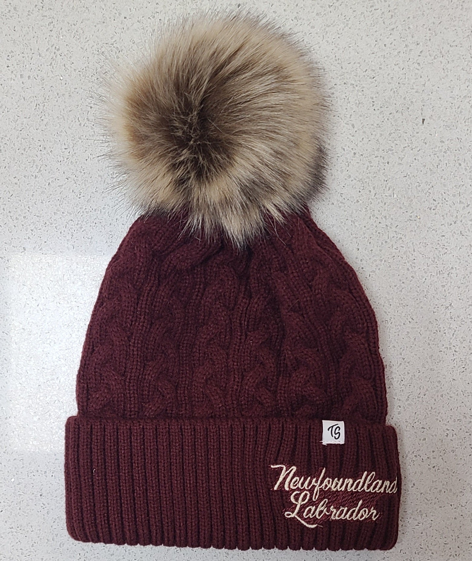 Winter hat with pom poms.