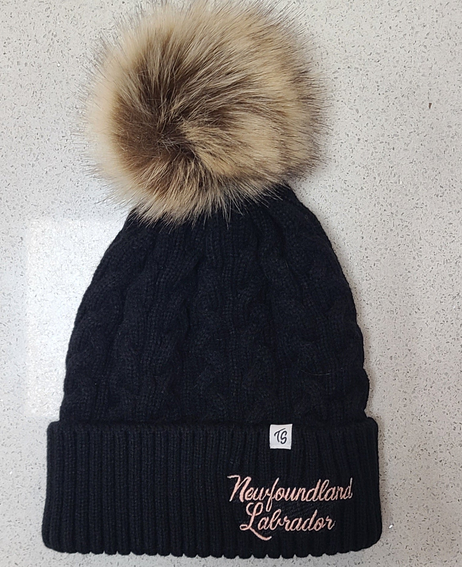 Winter hat with pom poms.