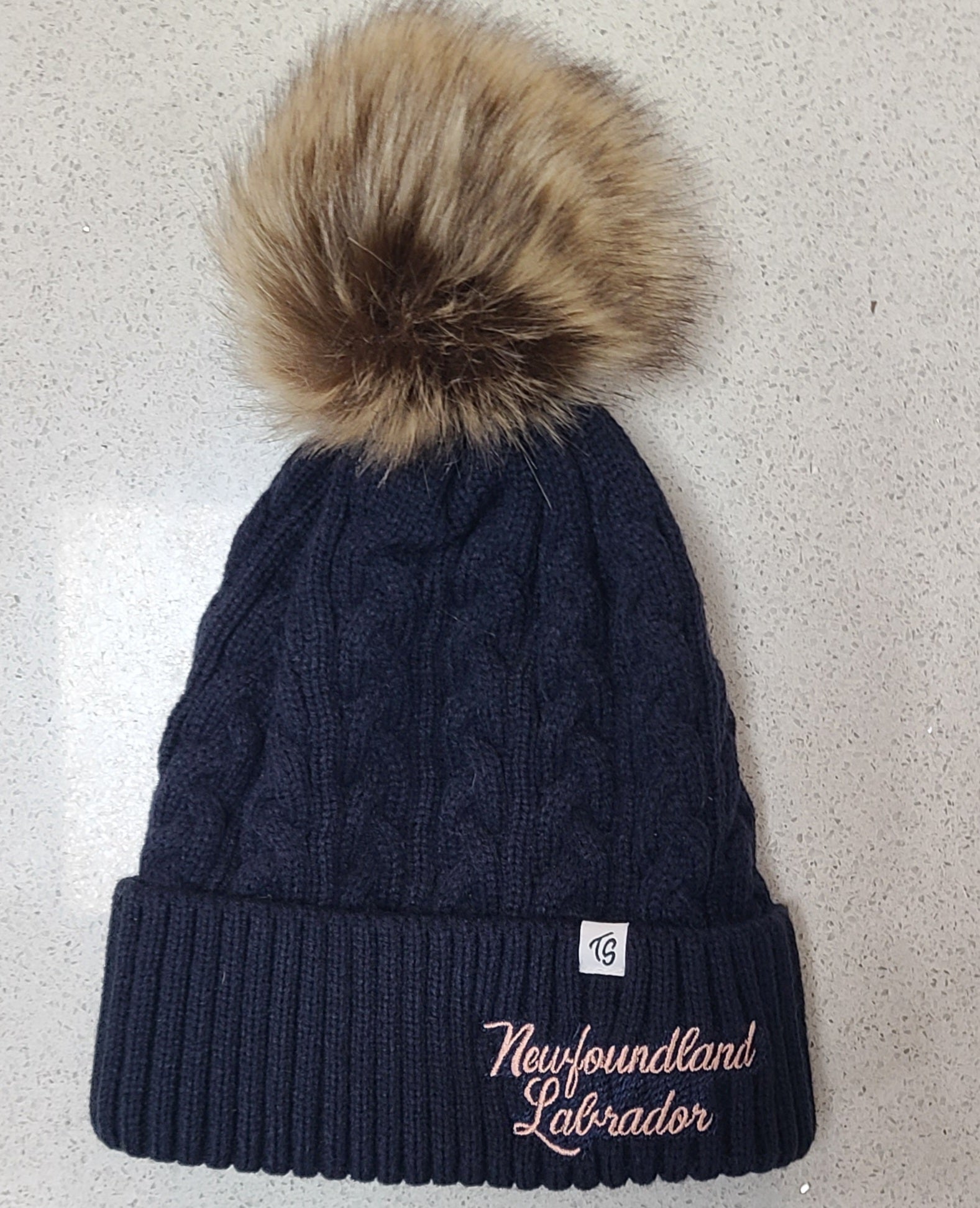 Winter hat with pom poms.