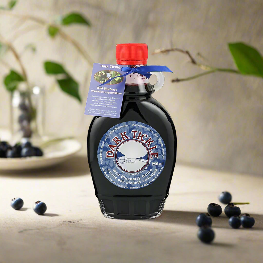 Dark Tickle Wild Blueberry Sauce in a 250 ml maple-style glass bottle with red cap and tag.